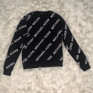 black Micheal kors sweater with print all around. Size small (IT IS USED)